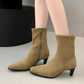 Brown square toe high heel ankle boots with a side zip and a stiletto kitten heel.