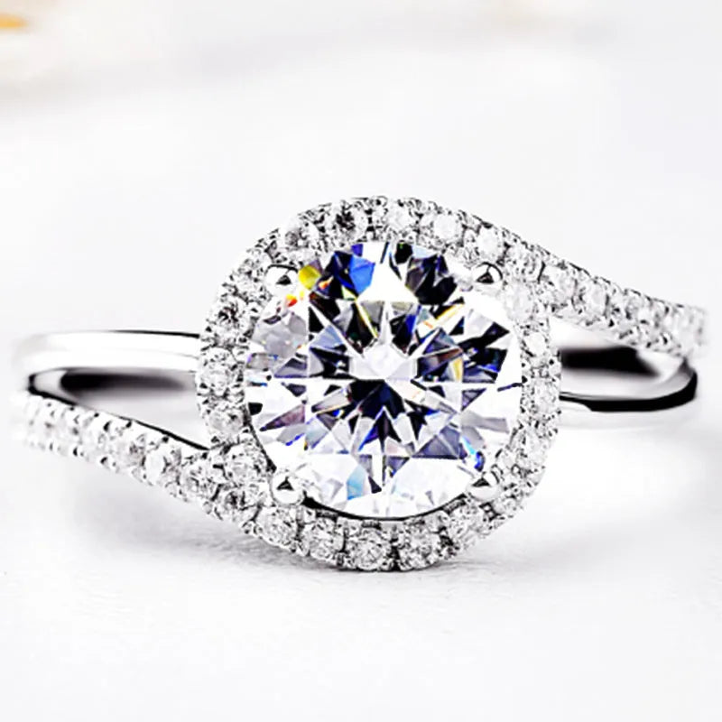 Diamond twist ring with small stones in white gold colour on copper base, adjustable opening
