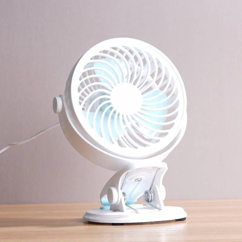 Mini USB desk fan shown in clip-on and floor-standing styles on a wooden desk.