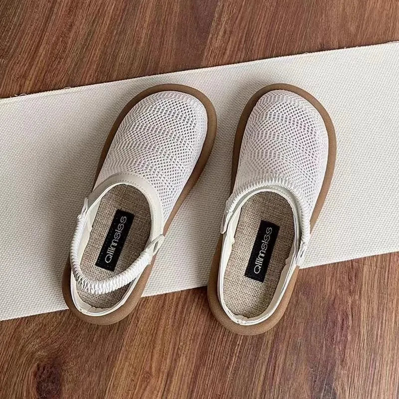 Beige linen slip-on shoes with a round toe and breathable mesh lining on a soft rubber sole.