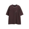 Man's loose fit black retro washed cotton short-sleeved t-shirt on a hanger.