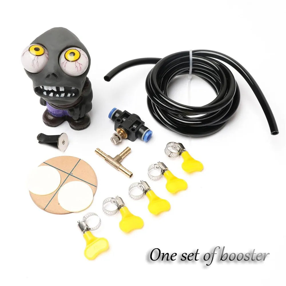 Turbo car blow-off valve pressure release kit showing rubber doll ornament, copper tube, pressure valve, and clips.
