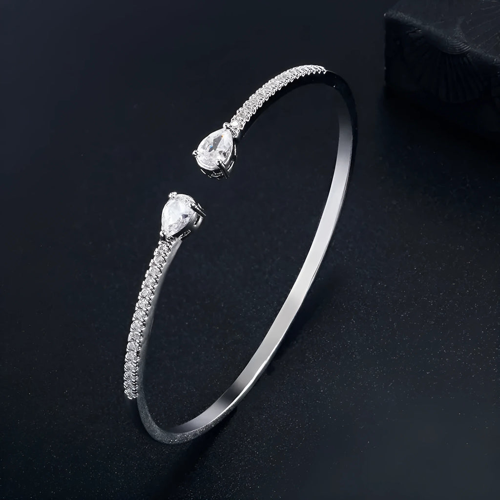 Multi-zircon fashion bracelet crafted from copper with zircon inlaid treatment in white or blue colour