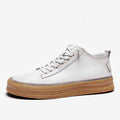 Men's black leather casual shoes with round toe and flat rubber sole on a white background.