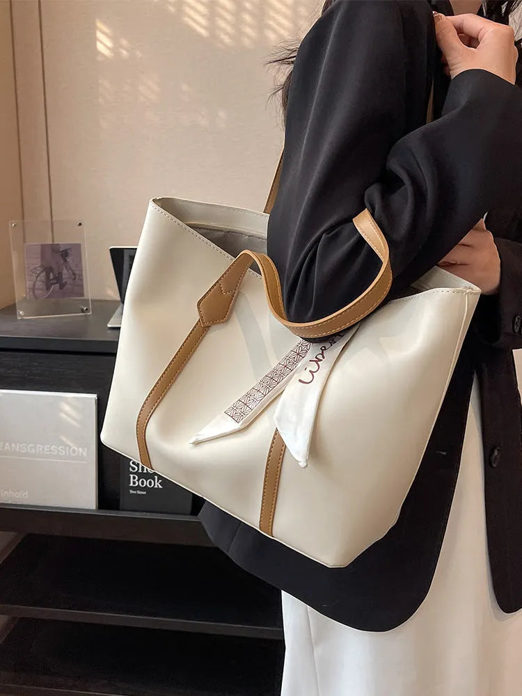 Soft large capacity tote bag with crossbody strap showing internal zipper compartment