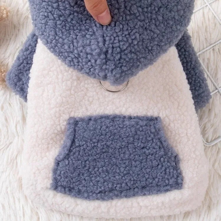 Brown hooded cotton-padded dog coat shown on model, with blue colour option available in sizes XS to XL