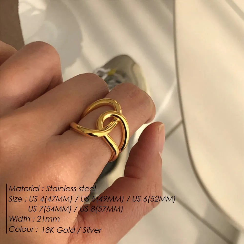 Geometric knotted women's adjustable ring in stainless steel, showing U-shaped opening.
