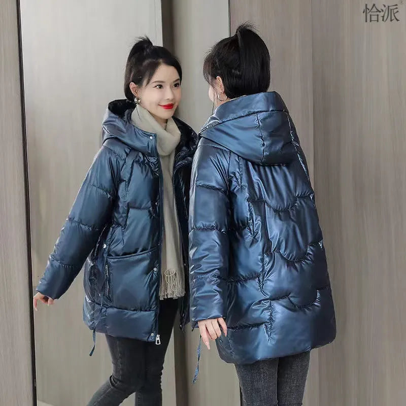 Women's loose-fit hooded winter jacket in blue with thick cotton filling.