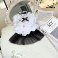 White polyester waltz gauze skirt princess dress for a small dog on a hanger.
