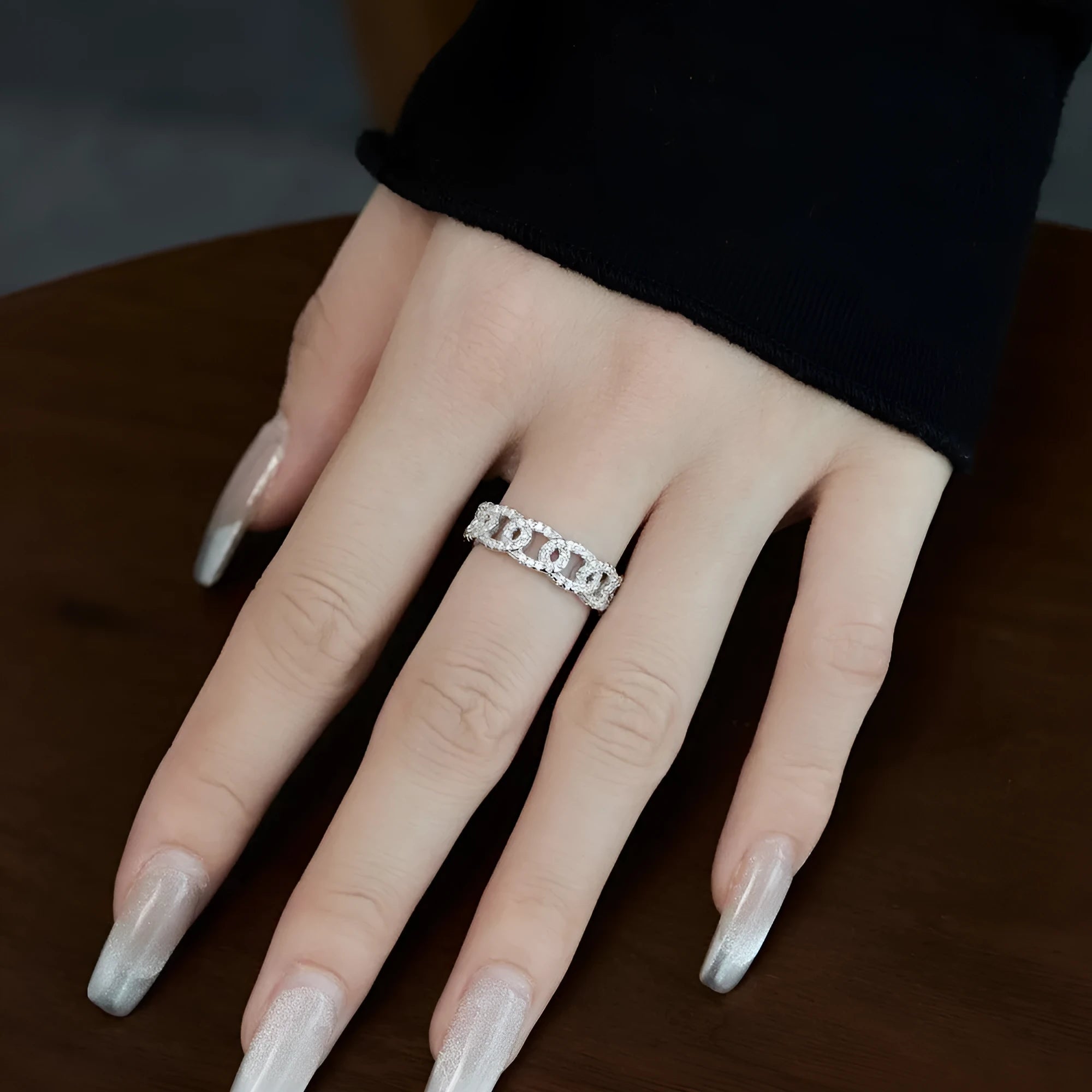 Silver punk chain ring for women with electroplated finish on white background