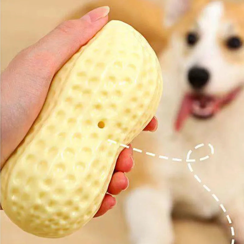 Yellow peanut-shaped dog chew toy with squeaker for dental cleaning
