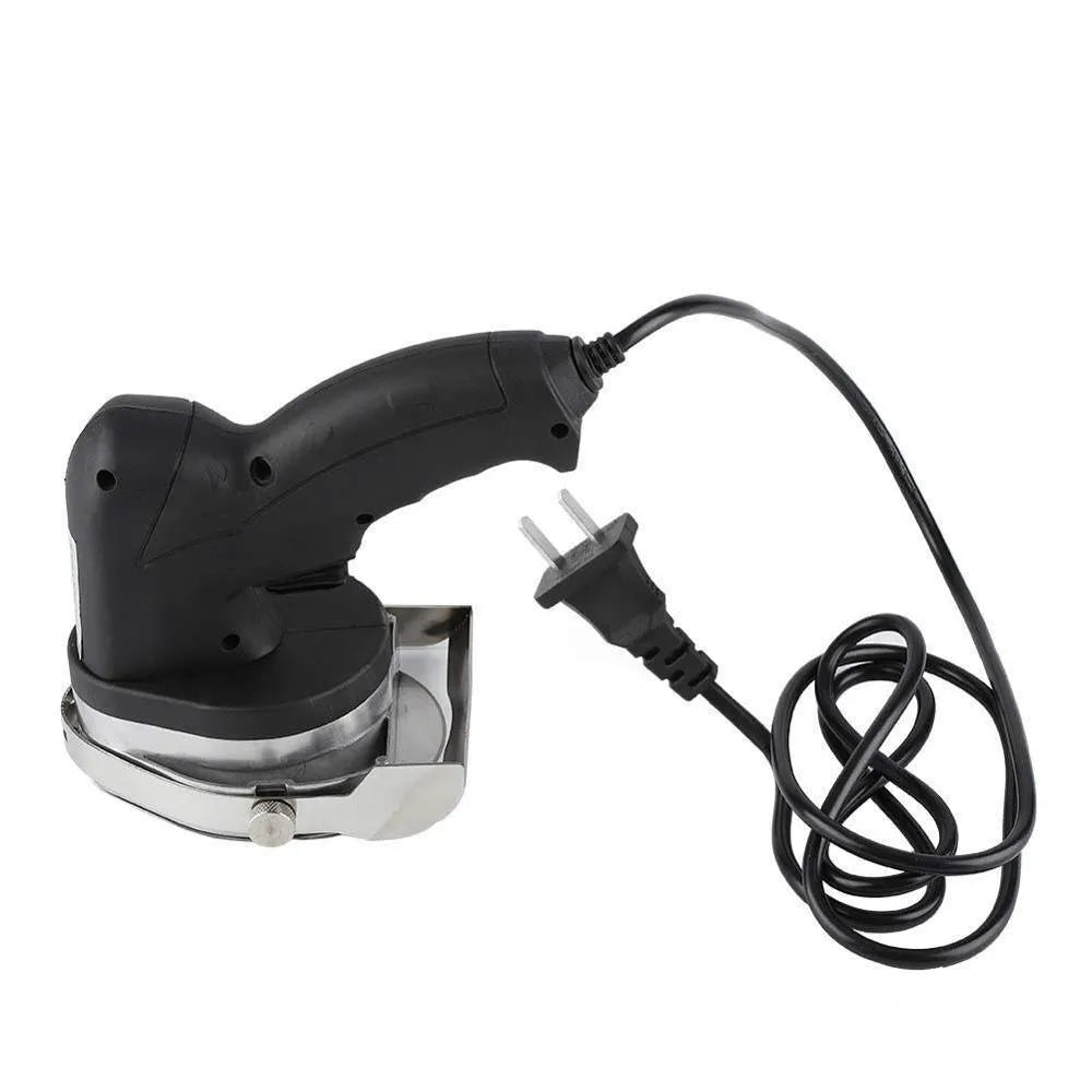 Black manual meat cleaver with adjustable blade for an electric turkey barbecue machine.