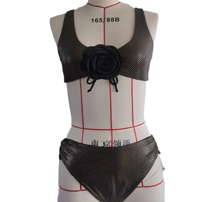 Black women's triangle swimsuit with 3D stereo design on a mannequin