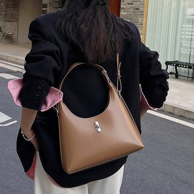 Women's apricot genuine leather crossbody bag showing dumpling shape and sandwich pocket design