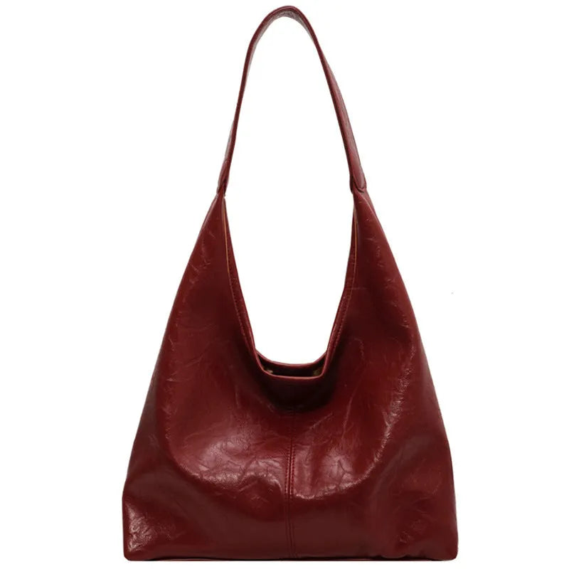 Women's casual shoulder bag in soft PU leather with sandwich pocket and visible sewing thread detail