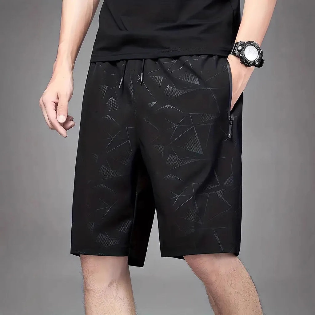 Men's loose-fit printed sports shorts in polyester fabric available in black, grey, or blue colours