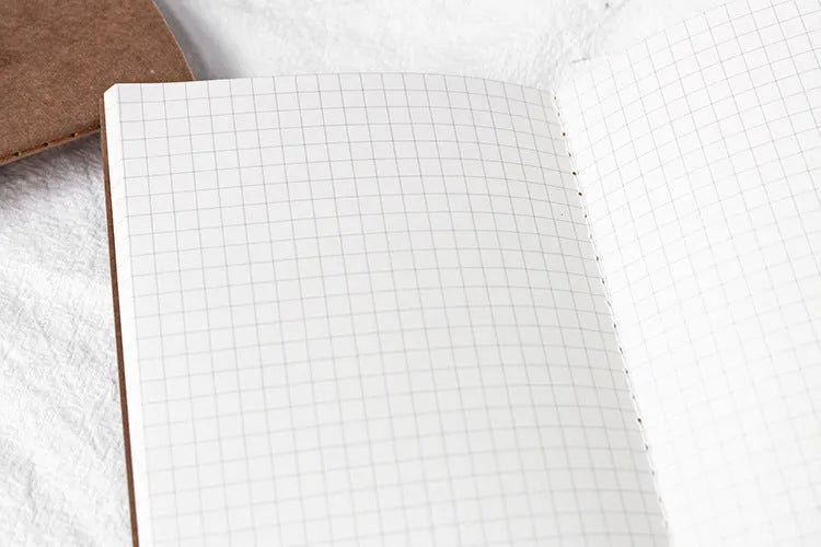 Travel cowhide diary refill notebook showing 11x21cm size and saddle stitch binding