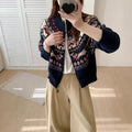 Beige apricot ethnic style jacquard pullover sweater with 3D pattern, round neck, and long sleeves laid flat.