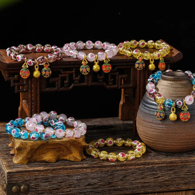Handmade heart-shaped glass bracelet with swallowing gold beast pattern in ancient fluorescent glaze