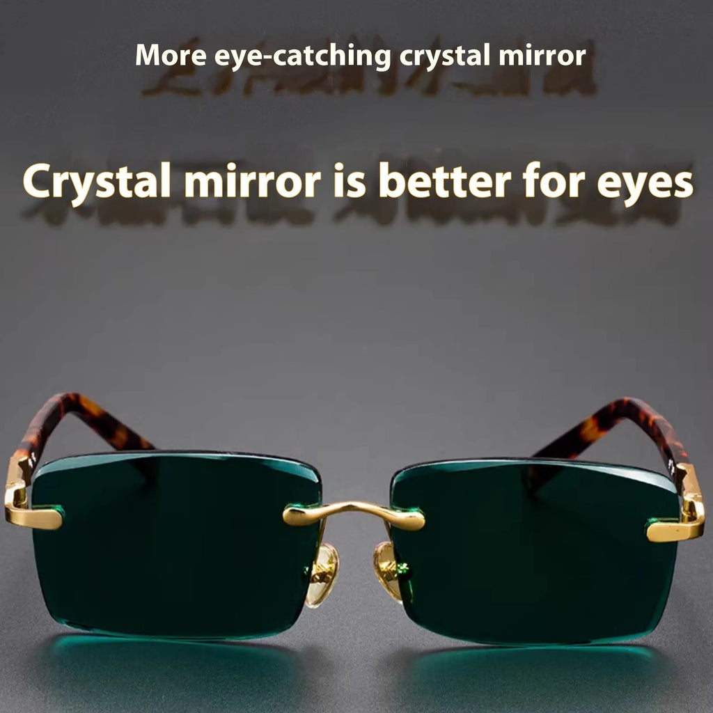 Dark green frameless crystal sunglasses with a hard case and cleaning cloth on a plain background.
