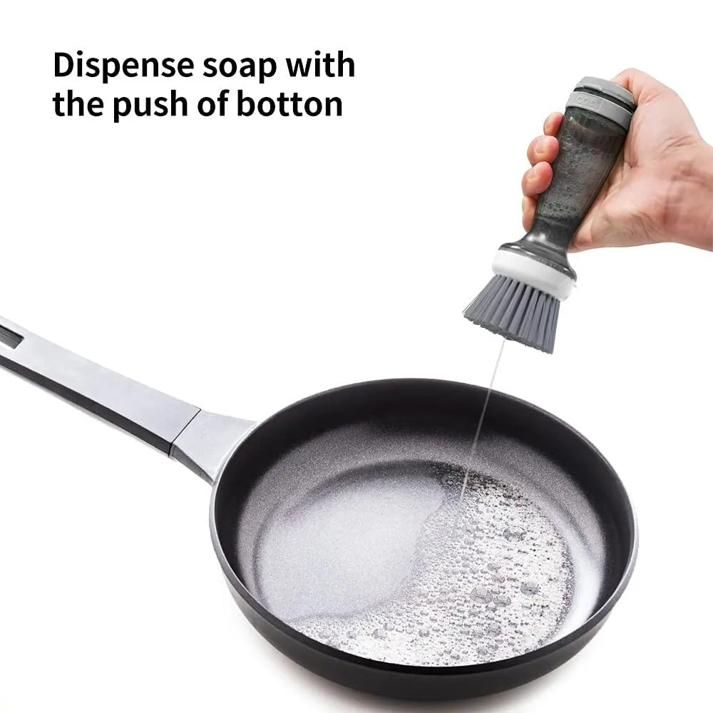 Milk white pot brush with soap dispenser in handle and non-scratch bristles for kitchen sink use.