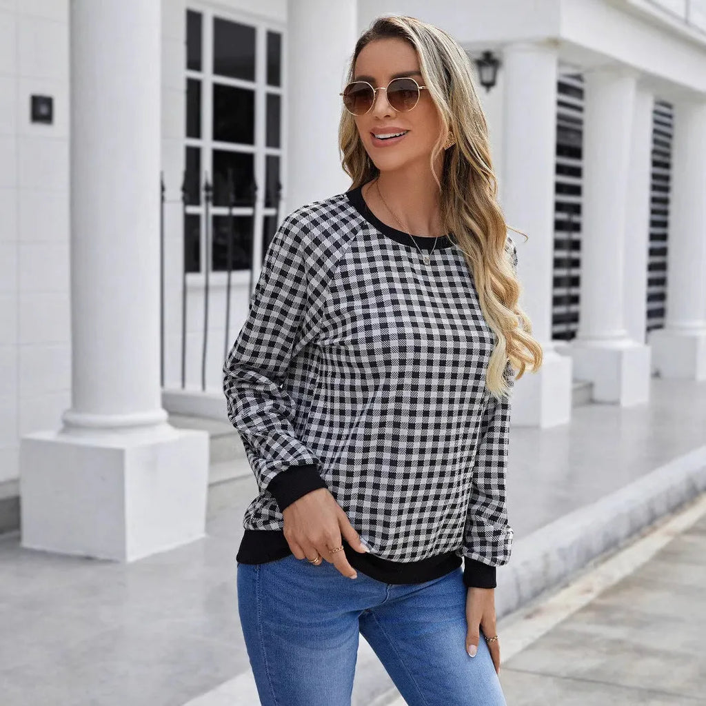 Black polyester pullover sweater with printed plaid and stripe pattern, long sleeves