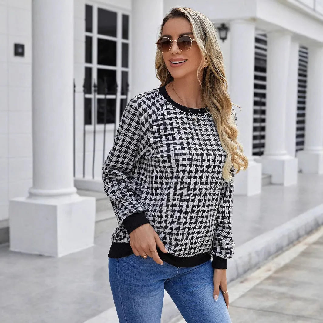 Black polyester pullover sweater with printed plaid and stripe pattern, long sleeves
