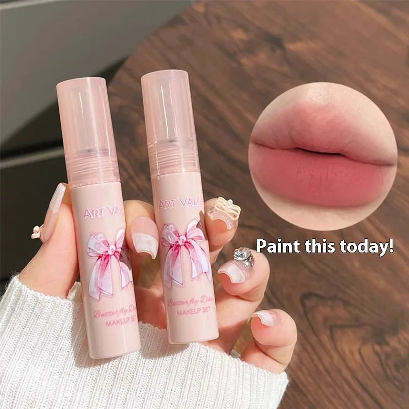 Pink Butterfly Box makeup set with four lip muds, a powder blusher, and a necklace
