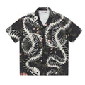 Men's loose fit short sleeve shirt with snake bone floral print and a Cuban collar.