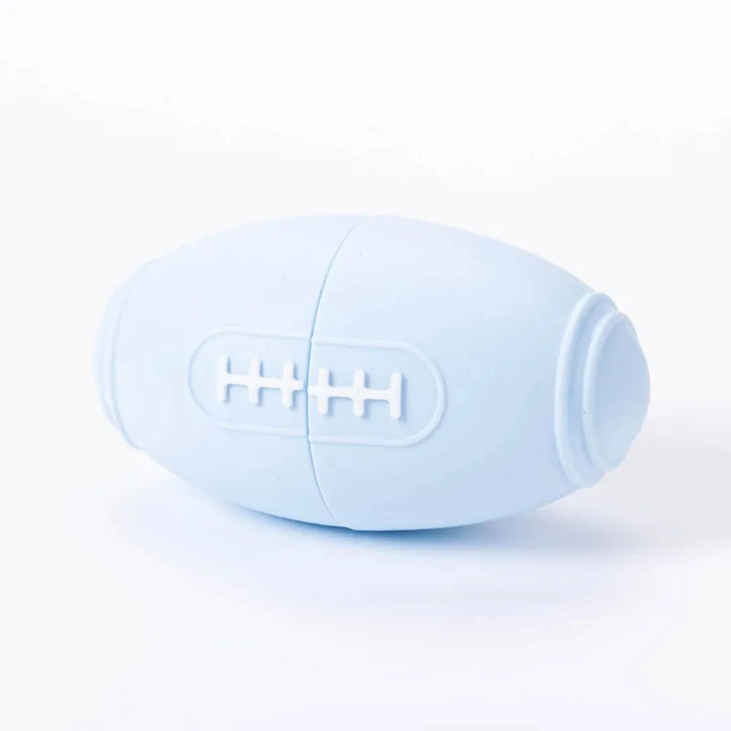 Silicone rugby ball dog chew toy with treat dispenser in four colour variations