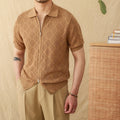 Man wearing a light brown, short sleeve cotton cardigan with a front zipper and lapel collar.
