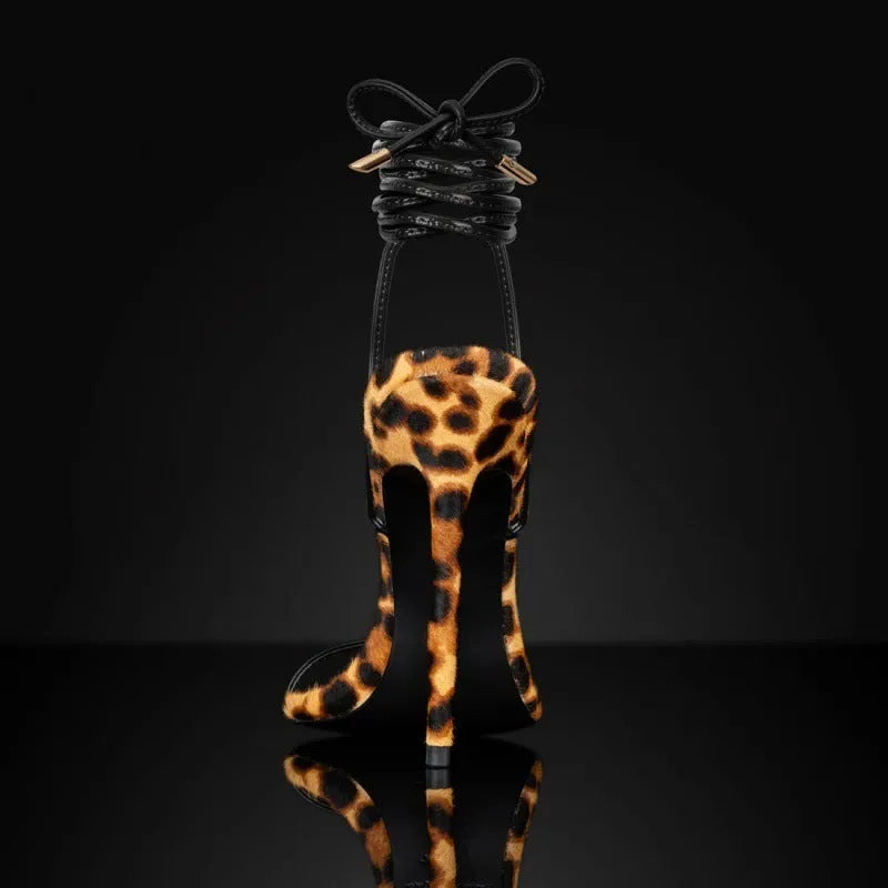 Women's leopard print Roman sandals with pointed toe and buckle fastening strap.