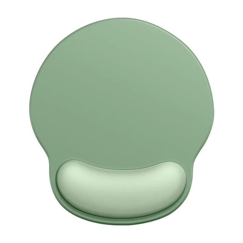 Silicone mouse mat with wrist support in gradient colour pattern on desk