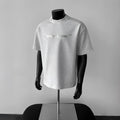 Men's white cotton short sleeve t-shirt with black printed letters, loose fit pullover style