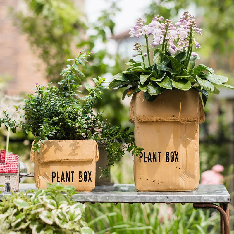 Cement flowerpot with brown paper box finish and drainage holes in bottom