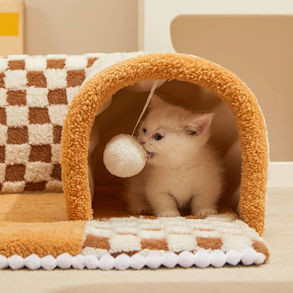 XL sized fan-shaped plush pet bed with an attached tunnel in coffee colour on a wooden floor.