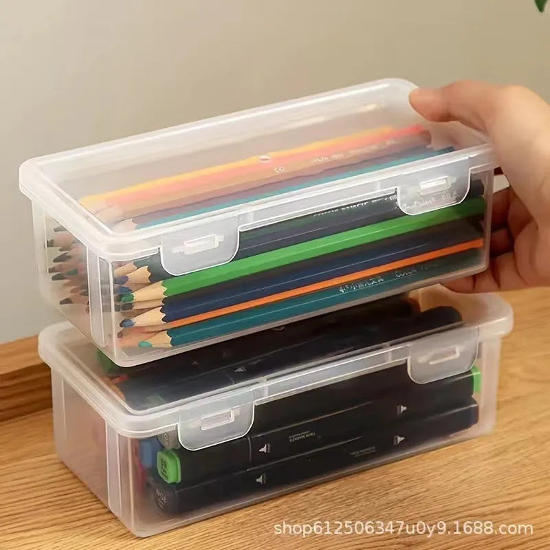 Clear plastic stationery storage box filled with assorted coloured pencils and crayons.