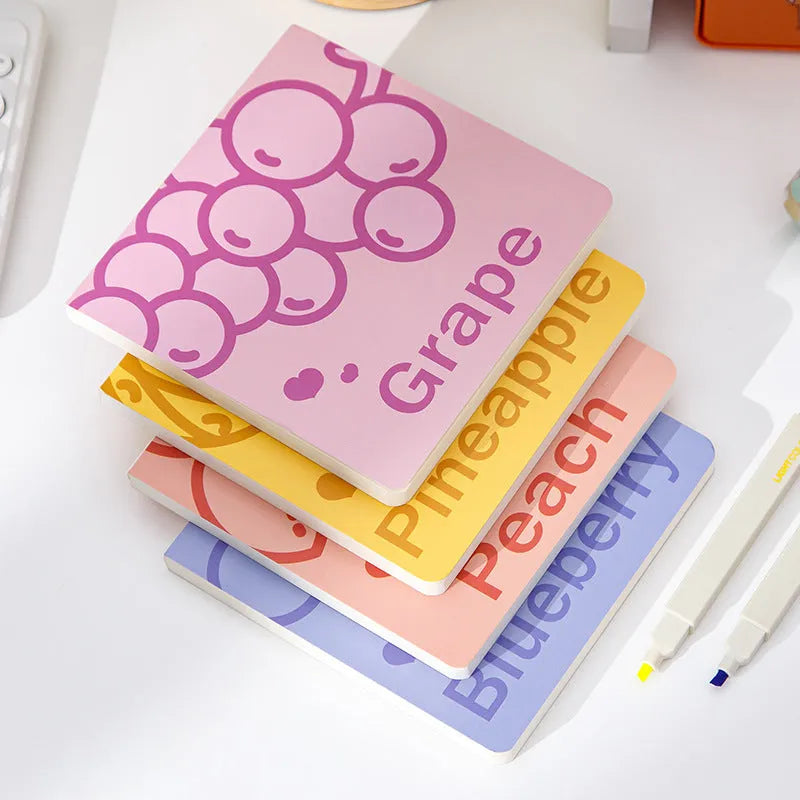 Square notebook with embossed fruit cover design showing 14.5cm dimensions and thickened paper pages