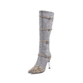 Grey and black women's knee high boots with a thin 9cm high heel on a rubber sole.