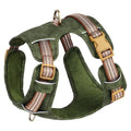 Brown leather dog harness with reflective stitching, adjustable straps, and chest attachment design