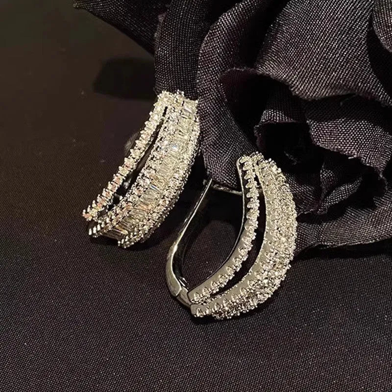 Geometric copper stud earrings with white gold finish and zircon stone decoration