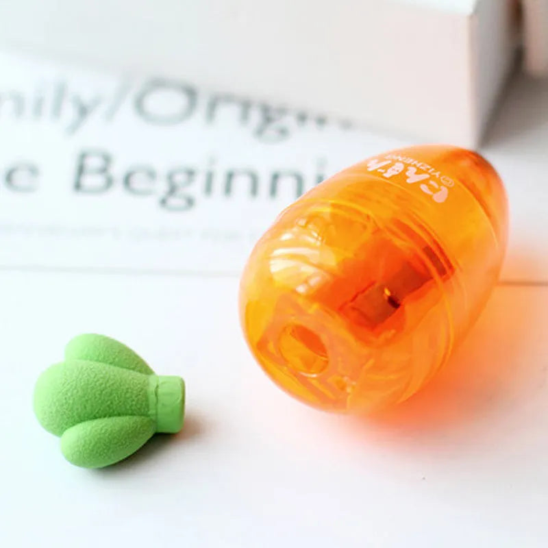 Orange carrot-shaped plastic pencil sharpener with 7cm handle length