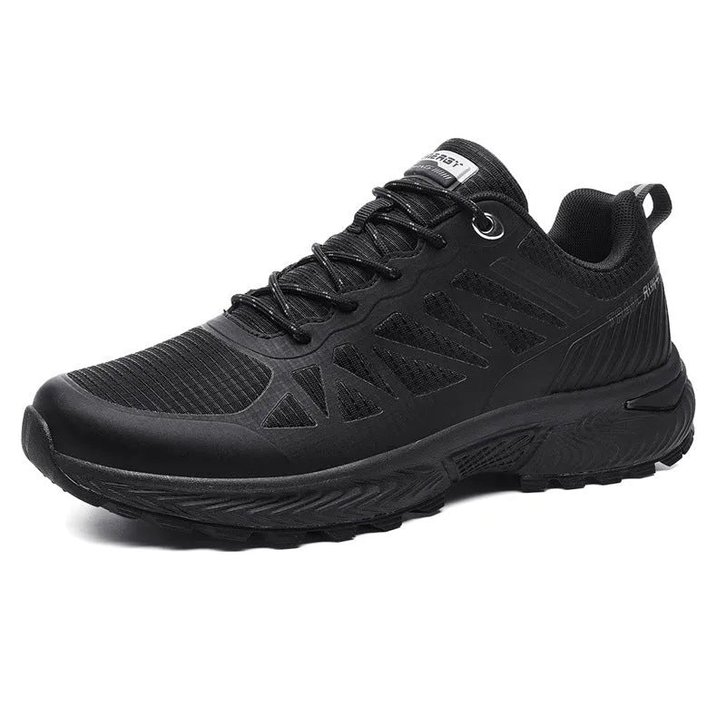 Men's black and orange breathable mesh running shoe with lace-up front on a flat heel.