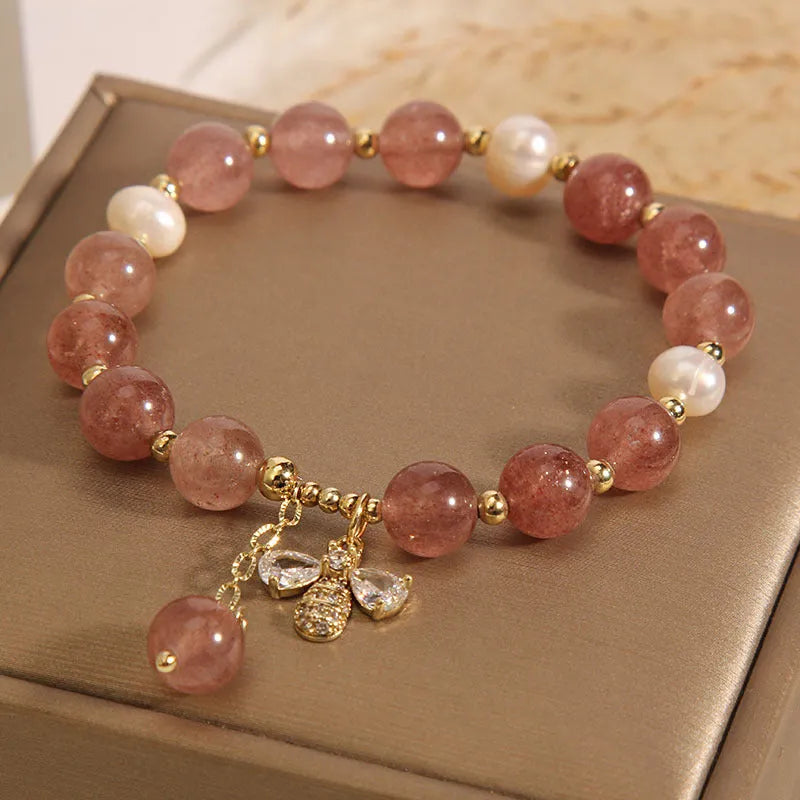 Women's alloy bracelet with three strawberry quartz stones, freshwater pearls, and zircon accents.
