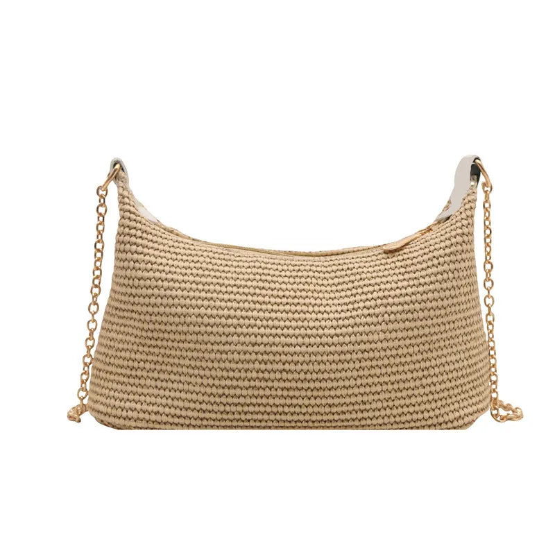 Khaki straw woven horizontal square tote bag with shoulder straps and outer sandwich pocket.