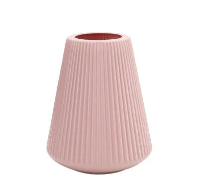 Blue melamine plastic decorative flower vase measuring 16cm by 20cm on a desktop