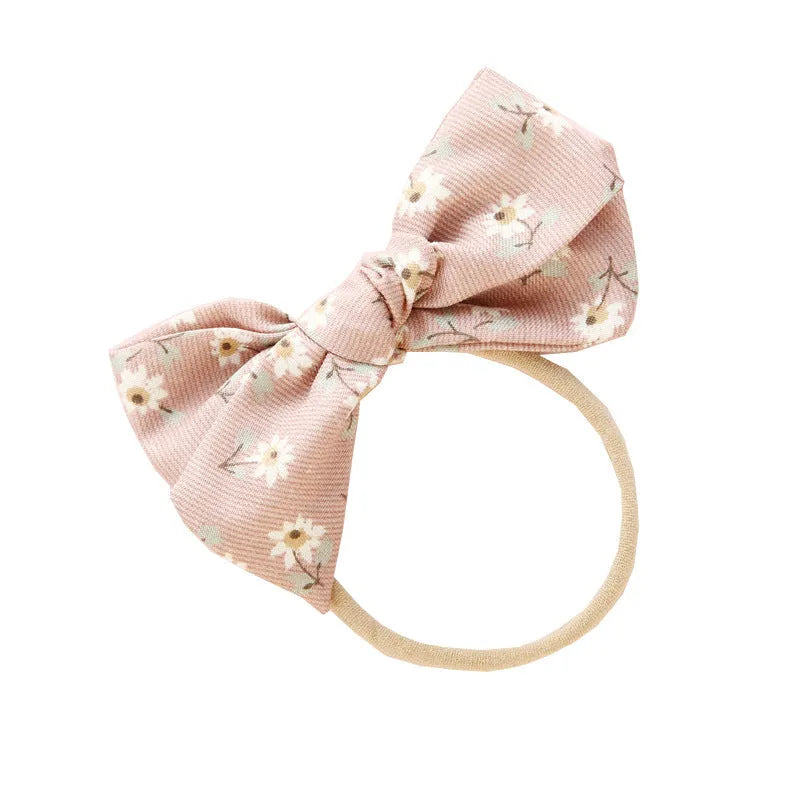 Children's knotted bow hair band in cloth fabric with six colour options
