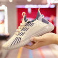 Men's white low-top sports shoes made of breathable flying fabric with mesh lining and a round toe.