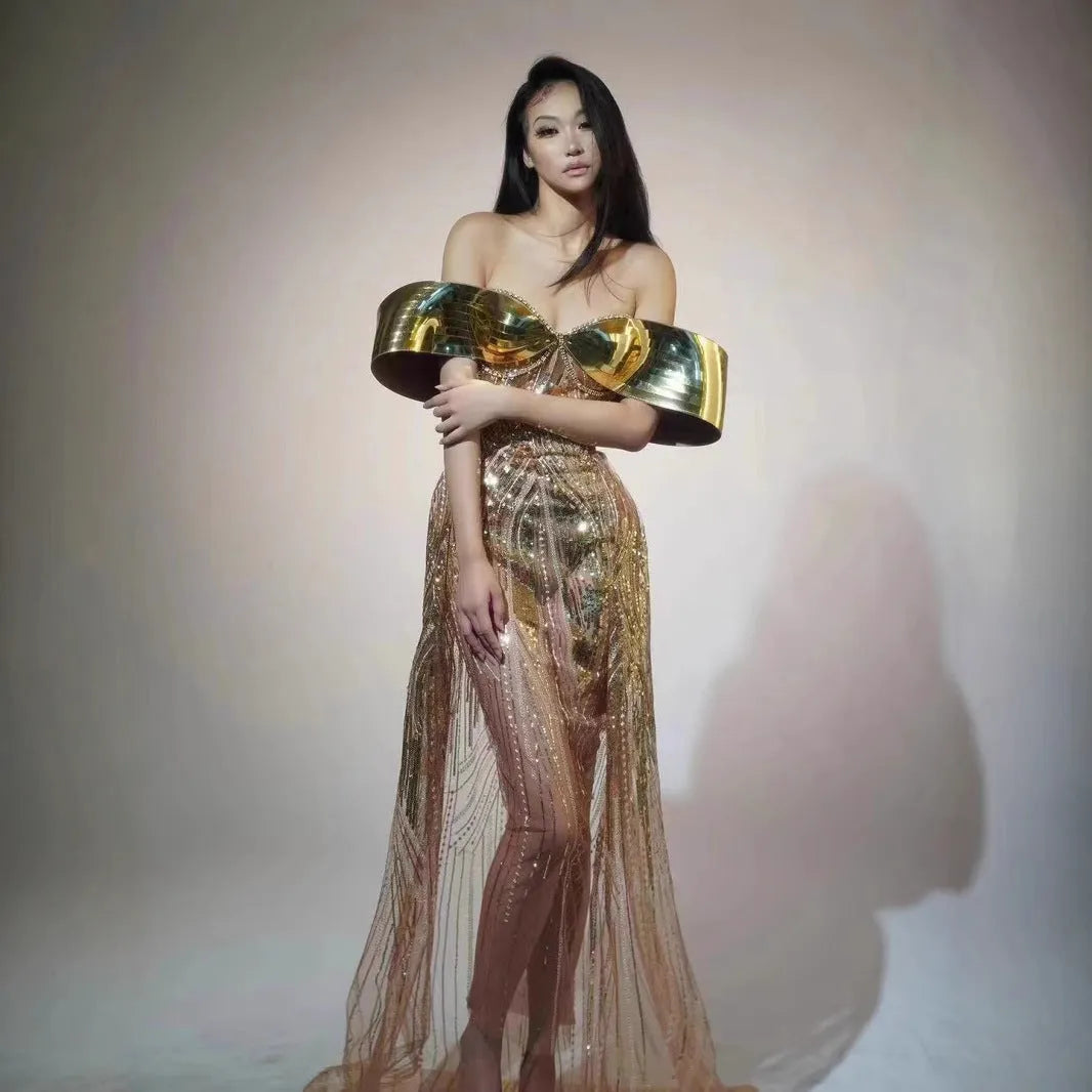 Gold strapless sequined formal dress with a side split on a long tulle skirt.