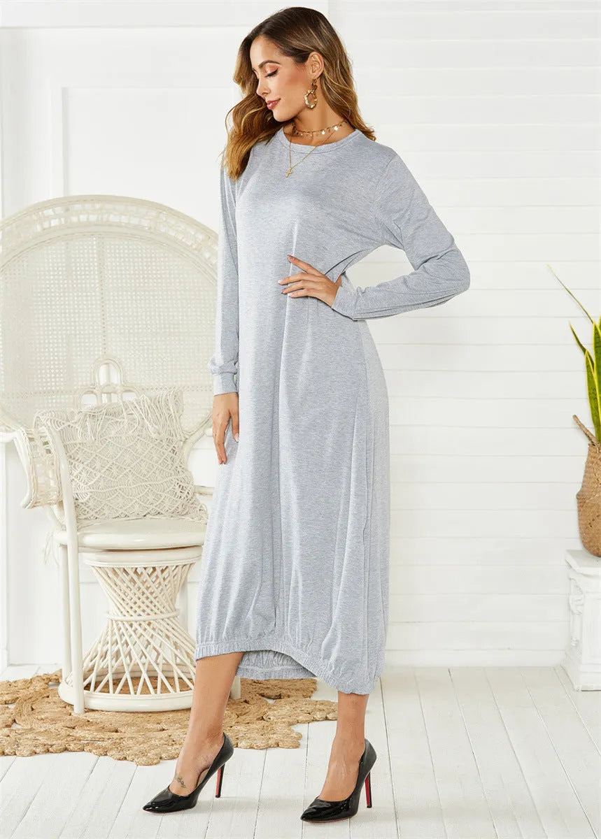 Women's loose black lantern dress with lace-up crew neck and long sleeves.